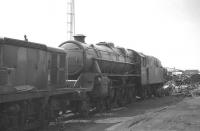 Black 5 No. 45305 photographed in Draper's scrapyard, Hull, on 12 August 1970. The diesel locomotive on the left is Clayton no D8605. The former Hull and Barnsley Railway Neptune Street yard eventually became the last port of call for in excess of 500 steam locomotives. Happily this particular example was rescued and later preserved.<br><br>[Bill Jamieson 12/08/1970]