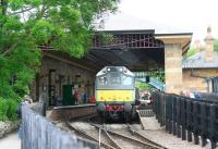 D7628 comes off a train of empty stock at Pickering on 28 June 2011. Note the station's recently completed overall roof, a replacement for the original 1846 structure removed by BR in the 1950s.<br><br>[John Furnevel 28/06/2011]