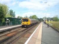 Merseyrail EMU 508120 leaves Bebington for Liverpool. With six trains an hour in each direction it is easy to forget that this line was only electrified in 1986. Prior to that date the EMUs stopped at Rock Ferry in Birkenhead and passengers changed into a DMU for onward journeys towards Chester. In the foreground the two metal plates between the rails mark the subway from the attractive street level booking office [See image 34759] to the down platform. <br><br>[Mark Bartlett 24/06/2011]