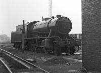 There's no room inside the shed for WD 2-8-0 No. 90417 <br>
which is receiving a soaking in the yard at Sunderland on the last Saturday of May 1967. Snug inside were four classmates, Nos. 90135, 90321, 90348 and 90698.<br><br>[Bill Jamieson 27/05/1967]