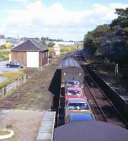 The daily mixed freight / parcels train from Inverness to Wick heads north from Tain in the summer of 1974.<br><br>[David Spaven //1974]