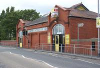 The station entrance and booking office on the road overbridge at Formby, seen in June 2011. Note the station name and LYR logo displayed within the mosiac on the front of the building.<br><br>[John McIntyre 26/06/2011]