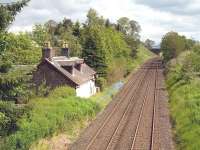 Site of the former Kinbuck station, standing alongside the B8033 north of Dunblane. View towards Perth from the road overbridge in June 2011. Kinbuck station was closed by BR in 1956.<br><br>[David Pesterfield 20/06/2011]