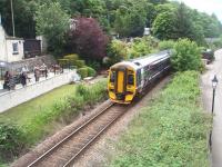 Real ale and really close trains. Customers in the beer garden at the Clachnaharry Inn look on as 158722 accelerates away from the swing bridge speed restriction on its way to Wick on 1 July with the mid day service from Inverness. <br><br>[Mark Bartlett 01/07/2011]