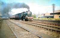B1 no 61180 heads west out of Edinburgh past Haymarket MPD with a commuter train in the summer of 1959.<br><br>[A Snapper (Courtesy Bruce McCartney) 04/07/1959]