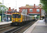A Liverpool bound service, with 508141 on the rear of a 6 car <br>
formation, leaving Formby station on 26 June 2011.<br>
<br><br>[John McIntyre 26/06/2011]