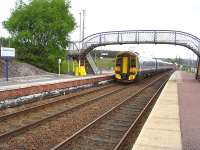 The mid-week 16.01 departure for Inverness pulls away from Dalwhinnie on 22 June and is about to run past the signal box as it continues its journey north. The 4 car train is made up of 158719 on the rear of 158714. <br><br>[David Pesterfield 22/06/2011]