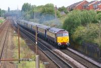 DRS Class 47 no 47790 in 'Northern Belle' livery heads south from <br>
Preston on the WCML at Farington with the Glasgow Central to Southampton Docks cruise liner charter on 8 July 2011. On previous runs the train has been double headed but this time it was top and tailed with a Class 37 on the rear.<br>
<br><br>[John McIntyre 08/07/2011]