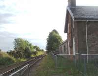 Originally named Culloden, until the direct line to Aviemore opened in 1898, Allanfearn was the first station out of Inverness on the line to Nairn. It closed in 1965 and like most others on the line is now a private residence. Early morning view towards Nairn from the level crossing.<br><br>[Mark Bartlett 01/07/2011]