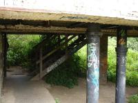 The less than salubrious access to the steps at the rear of the former Charles Roberts Wagon Works car park [see image 34789] giving access to the walkway through the rail bridge over the River Calder.<br><br>[David Pesterfield 06/07/2011]