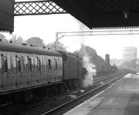 Black 5 no 45357 restarts an extra for Ayr out of Platform 1 at Paisley Gilmour Street in June 1966. Note the trailing crossover beyond the platform alongside Stoneybrae signal box. [See image 34828].<br><br>[Colin Miller /06/1966]