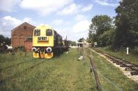 Side by side. Scene in the former goods yard at Yaxham in June 1995. The station, which lost its passenger service in October 1969, is now home to both the Mid-Norfolk Railway and the 2ft gauge Yaxham Light Railway.<br><br>[Ian Dinmore /06/1995]