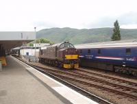 EE Type 3 No. 37676, West Coast Railway's appropriately named <I>Loch Rannoch</I>, complete with painted 10A (Carnforth) shed plate on each nose, was stabled alongside the Caledonian Sleeper stock at Fort William on Sunday 3rd July 2011.<br><br>[Mark Bartlett 03/07/2011]