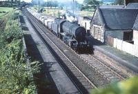 WD 2-8-0 no 90229 runs north through Lochside with a freight in August 1959.<br><br>[A Snapper (Courtesy Bruce McCartney) 22/08/1959]