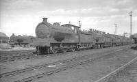 J27 0-6-0 no 65853 et al lined up at 51L Thornaby on 26 March 1961. Britain's last purpose-built steam shed had opened on a 70 acre site here 3 years earlier as a replacement for the old sheds at Stockton, Haverton Hill, Newport and Middlesbrough. The shed closed to steam in December 1964, some six and a half years after opening. Thornaby closed completely in 2009.<br><br>[K A Gray 26/03/1961]