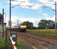 Down ECML train about to pass over Ulgham Lane level crossing south of Widdrington, Northumberland, on 19 July 2011, heading for Edinburgh Waverley. <br><br>[Colin Alexander 19/07/2011]