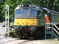 <I>'...and you!'</I> Exchange at New Bridge level crossing on 29 June 2011. The train is the 10.00 ex-Pickering seen shortly after getting underway behind D7628.<br><br>[John Furnevel 29/06/2011]