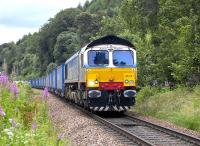 Stobart-liveried 66414 <I>'James the Engine'</I> approaching the northern outskirts of Pitlochry with the 4Z50 Inverness - Coatbridge 'Intermodal' container train on 19 July 2011.<br>
<br>
<br><br>[Bill Roberton 19/07/2011]