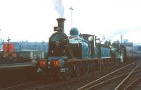 One of the many specials operated in connection with the Scottish Industries Exhibition, staged in the City of Glasgow during the month of September 1959. This particular example, train no 380, is seen shortly after arrival at Partick Central on 19 September 1959 behind CR no 123 + GNSR no 49 <I>Gordon Highlander</I>. [Three months earlier the station had been renamed Kelvinhall in recognition of one of the exhibition's main venues located nearby] <br><br>[A Snapper (Courtesy Bruce McCartney) 19/09/1959]