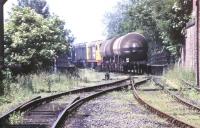 A pair of class 20s about to propel CO2 tanks into the distillery sidings at Cameron Bridge in July 1991.<br><br>[Ian Dinmore /07/1991]