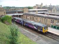 A consequence of the 2011 Arnside viaduct closure was the replacement of the Heysham boat train with a bus service from Lancaster station. Presumably the train was used for an extra service to Morecambe. All returned to normal when the bridge reopened on 18 July and two days later 142090 is seen in Platform 5 at Lancaster waiting to depart for the port.<br><br>[Mark Bartlett 20/07/2011]