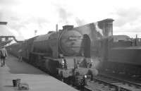 Leeds based A1 Pacific no 60131 <I>Osprey</I> utilising the water column on Carlisle platform 1 on the afternoon of 25 July 1964. The train is the the 9.30am London St Pancras - Glasgow St Enoch.<br><br>[K A Gray 25/07/1964]