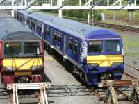 320 units stabled in the sidings at Yoker depot on 23 July 2011. View is north west towards Dalmuir with the main line running past on the extreme right of the photograph. <br><br>[Veronica Clibbery 23/07/2011]