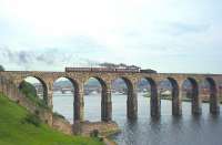 Standard Class 2 no 78048 takes the last passenger train from Berwick to Kelso and St Boswells across the Royal Border Bridge shortly after 6.35pm on 13th June 1964. The loco will run round its train at Tweedmouth station (which also closed the same day) in order to access the branch line.<br><br>[Frank Spaven Collection (Courtesy David Spaven) 13/06/1964]