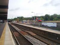 Platform 4 at Blackburn, normally used for Manchester and Preston bound services, is temporarily out of use while a new waiting room is constructed. This means that all passenger trains are being concentrated on the island platform (and its bay) and the rails through Platform 4 are gathering rust. This view looks east towards Blackburn tunnel from Platform 2 and shows the work in progress. <br><br>[Mark Bartlett 23/07/2011]