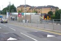 The single-platform terminus at East Kilbride looking west along Torrance Road on a Monday morning in August 2006. The buffer stops are just off picture to the right, while to the left is the large station car park. The 10.26 service, calling all stations to Glasgow Central, is currently boarding. <br><br>[John Furnevel 21/08/2006]