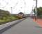 One of the DBS <I>Euro Cargo Rail</I> fleet no 66033 runs through Ardrossan South Beach at speed with 4J06 Longannet - Hunterston empty HTAs on 26 May 2011.<br><br>[Ken Browne 26/05/2011]
