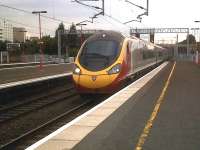 The styling of the Southbound Pendolino {the 19.20 to Euston} blends in well with this starkly modern station serving the NEC and Birmingham Airport.<br><br>[Ken Strachan 21/07/2011]