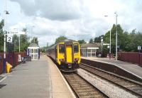 Appearances can be deceptive. Darwen looks like a deserted station on a double track line but in fact a sizeable number of Saturday shoppers had just joined 156472 heading north towards Blackburn on 23 July. The two tracks are actually a long passing loop, the only one on the ten mile single line section between Blackburn and Bromley Cross.<br><br>[Mark Bartlett 23/07/2011]