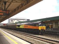 Colas Rail liveried former 66844 (now renumbered to 66745 and operated by GB Railfreight) runs through Cardiff Central mid afternoon on 19 July 2011 heading west with a train of short wheelbase bogie continental steel wagons. <br><br>[David Pesterfield 19/07/2011]
