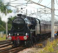 Black 5 no 45305 sets off from a watering stop at Carnforth on 23 July 2011. The train is the <I>'Cumbrian Mountain Express'</I> railtour from Crewe to Carlisle, via Liverpool Lime Street.<br>
<br><br>[John McIntyre 23/07/2011]