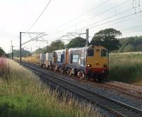 A rare sight these days and very welcome on a fine summer evening in July 2011. DRS 20308 and 20309 head the 6K73 Sellafield to Crewe flasks south along the WCML. 20309 emerged from Robert Stephenson Hawthorn works as D8075 in the summer of 1961 and so has just celebrated its fiftieth birthday. 20308, as D8187, was from the later <I>post Clayton</I> batch built at Vulcan Foundry in 1967. The distinctive EE whistle from their engines' exhausts as they ambled past evoked many memories.  <br><br>[Mark Bartlett 27/07/2011]