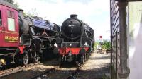 Scene at the east end of Glenfinnan station on a sunny 27th July 2011 as the returning <I>Jacobite</I>, hauled by Black 5 no 45231, meets its Mallaig-bound offspring behind 44871. The following day the latter carried <I>The Cambrian</I> headboard on its smokebox.<br><br>[Colin Miller 27/07/2011]