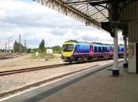 When is a platform not a platform? Platform 4 at York is in fact the north end of platform 3 and is used only by trains arriving off the Scarborough line. This view north from the said platform on 29 June 2011 shows a Liverpool - Scarborough train running left to right across the picture heading for the bridge over the River Ouse, shortly after leaving platform 5. On the left is the view north along the East Coast Main Line.<br><br>[John Furnevel 29/06/2011]