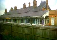 The old station at Welshpool in July 2011 - now a shopping mall, albeit with a well kept roof. The fence separates the railway from the bypass. [See image 35062]<br><br>[Ken Strachan 21/07/2011]