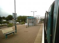 The new station at Welshpool, opened in 1992 [see image 35058]. Wide, windswept platforms, and bus shelter waiting areas. At least there's a bin.<br><br>[Ken Strachan 21/07/2011]