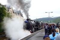 45231 poses with 'The Jacobite' for a group of admirers on 28 July prior to departing from Fort William.<br><br>[John Steven 28/07/2011]