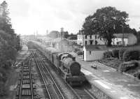 6984 <I>Owsden Hall</I> with a train at Clunderwen, Pembrokeshire, thought to have been photographed in the early 1960s. Built at Swindon in 1948, this locomotive was withdrawn by BR in 1966. Following a spell in Woodham Bros scrapyard 6984 was rescued and is currently undergoing restoration on the Gloucestershire Warwickshire Railway at Toddington.<br><br>[W A Camwell Collection (Courtesy Peter Francis) //]