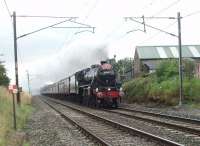 45305 was back in charge of the <I>Cumbrian Mountain Express</I> again on 6th August 2011. Running around fifteen minutes early the Black 5 is seen heading north on the approach to the former level crossing at Woodacre, just before the heavens opened.<br><br>[Mark Bartlett 06/08/2011]