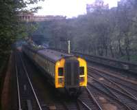 Princes Street Gardens - the last day of DMU operation on the E&G in May 1971. The next day, the fastest train journey times fell to 43 minutes with the Class 27 push-pull services [see image 35094] - and in 2011 the journey takes longer than it did then!<br><br>[David Spaven /05/1971]