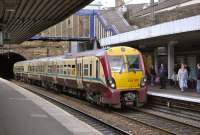 334 020 leaves Haymarket Tunnel and pulls up at platform 4 on 9 August with a train for Milngavie.<br><br>[Bill Roberton 09/08/2011]