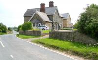 Looking west over the site of the level crossing to the former Scorton station on the Richmond branch in North Yorkshire. The station lost its passenger service in 1969 with the branch closing to all traffic a year later.<br><br>[John Furnevel 27/06/2011]