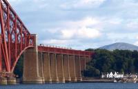 View south over the Forth Bridge towards South Queensferry on the evening of 10 August 2011 with the 1500 'East Coast' London Kings Cross - Aberdeen HST crossing.<br><br>[Brian Forbes 10/08/2011]