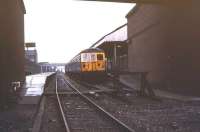 One of the unique British Rail 1200 volt DC Class 504 EMUs with side-contact current collection, built for the Manchester - Bury line, stands in the pouring rain at Bury Bolton Street in 1979 prior to heading south with a return working to Manchester Victoria.<br><br>[Ian Dinmore //1979]