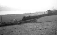 A Gourock bound BR standard class 4 2-6-4T ('Big Pug' according to a former engineman) heads west along the Clyde in fading light near West Ferry, between Bishopton Tunnel and Langbank, in February 1966. <br><br>[Colin Miller /02/1966]