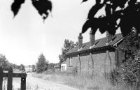 A 1975 view north west from the former Cardrona station towards Peebles, with the bridge over the Tweed visible in the left background. The photograph pre-dates the first trials of the Cadbury's <I>Wispa</I> bar by almost 6 years [see image 30173]<br>
<br><br>[Bill Roberton //1975]